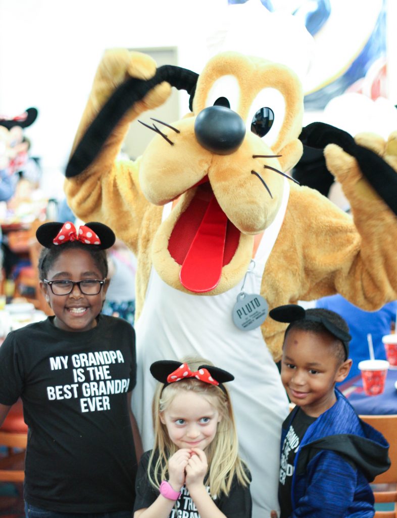 Pluto with 3 kids at chef mickey's