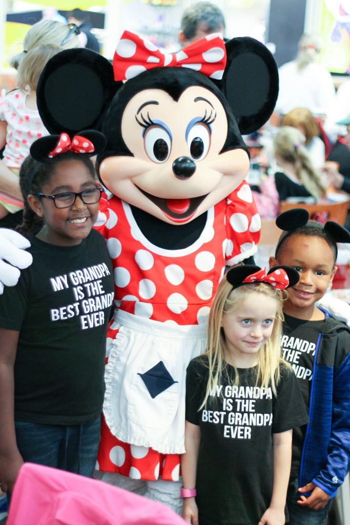 Minnie Mouse and three kids