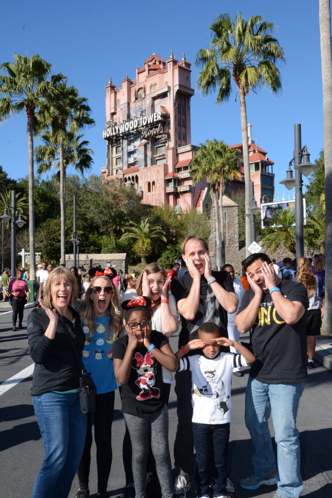 family in front of tower of terror