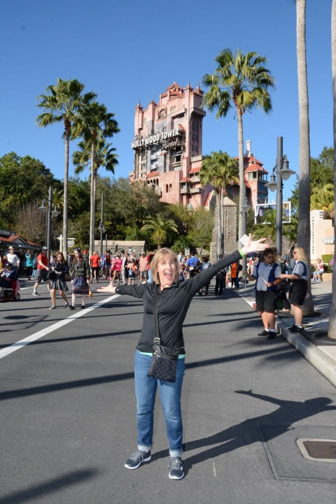 woman in front of Hollywood tower