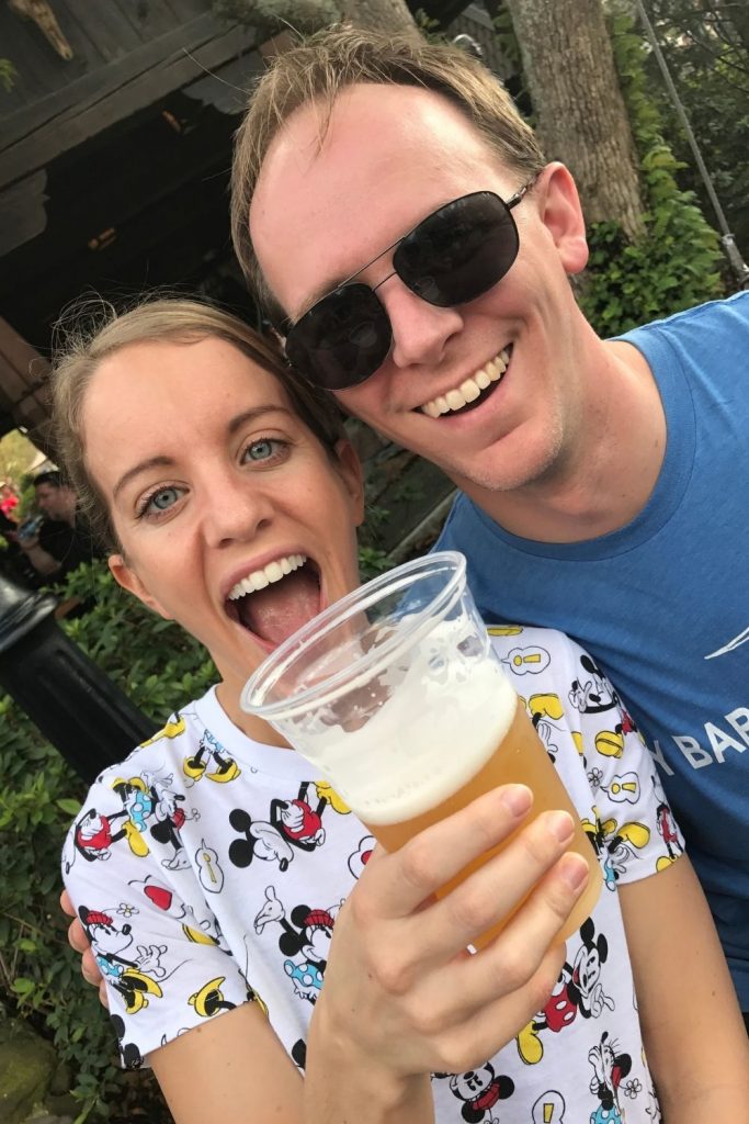 man and woman drinking a beer