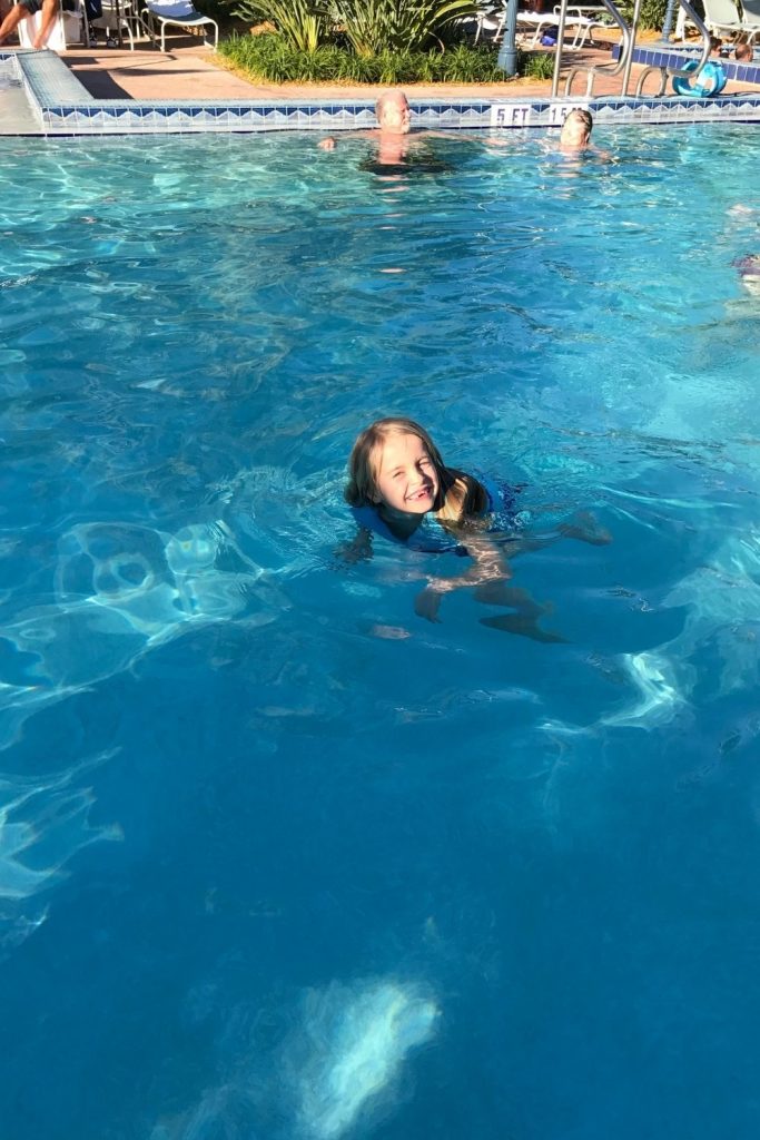girl swimming at disney pool