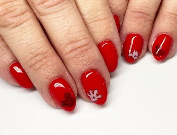red nails with mickey hands