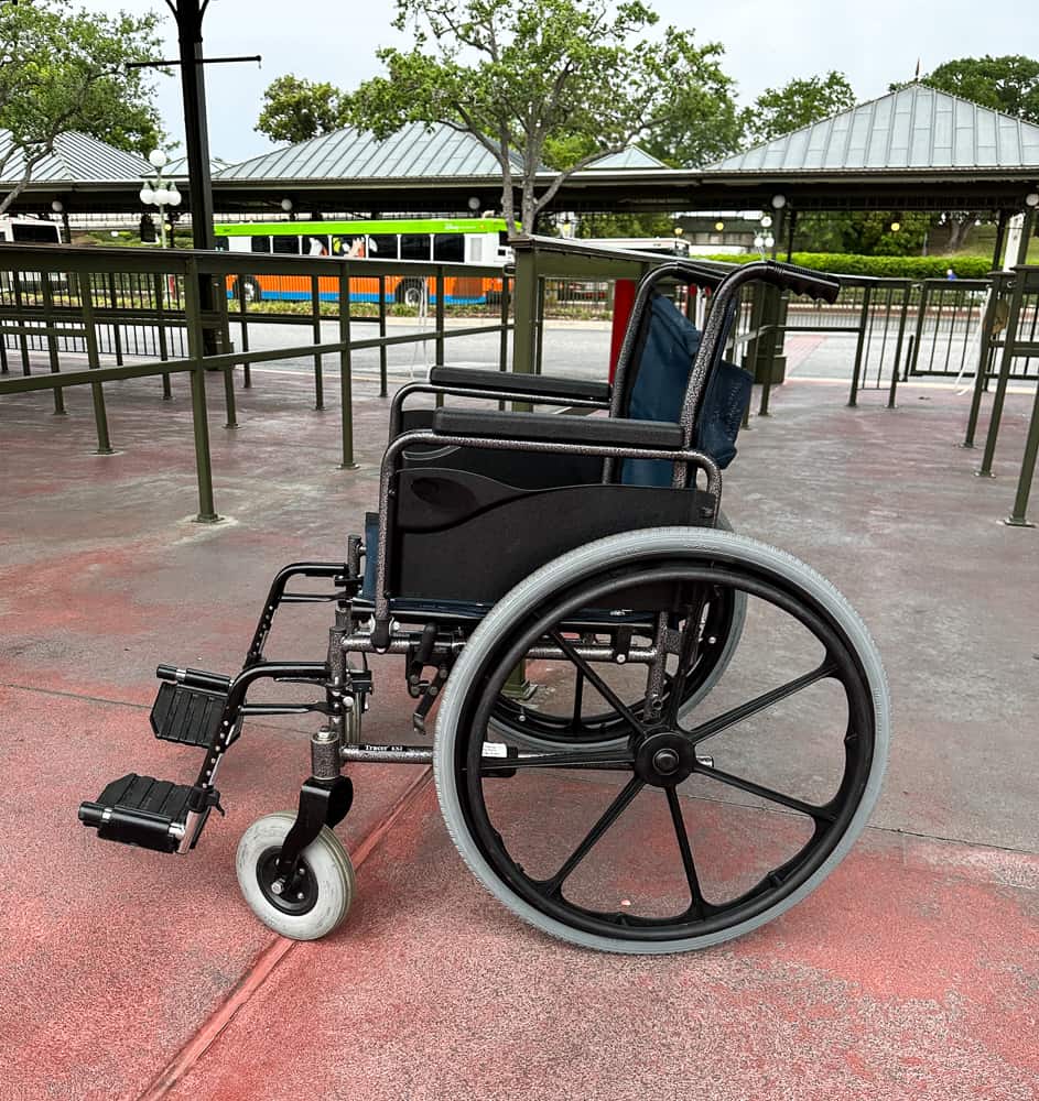 wheelchair in front of magic kingdom