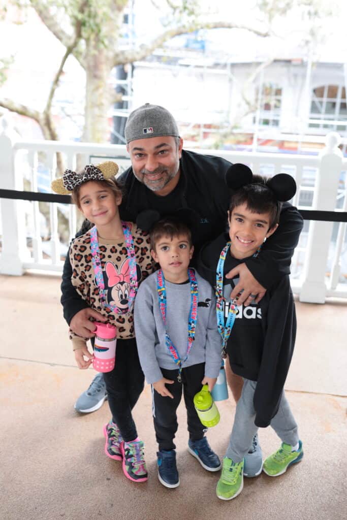 dad and 3 kids at Disney World
