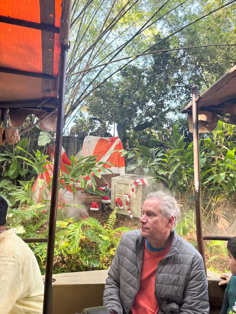 man in puffer jacket at disney world