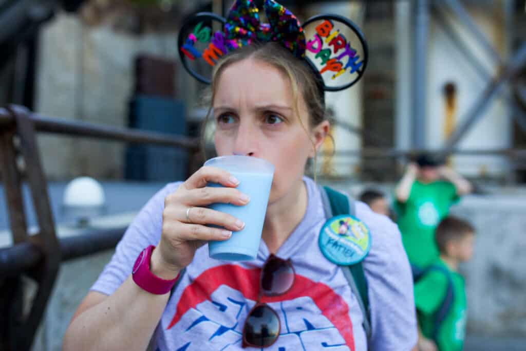 woman drinking blue milk