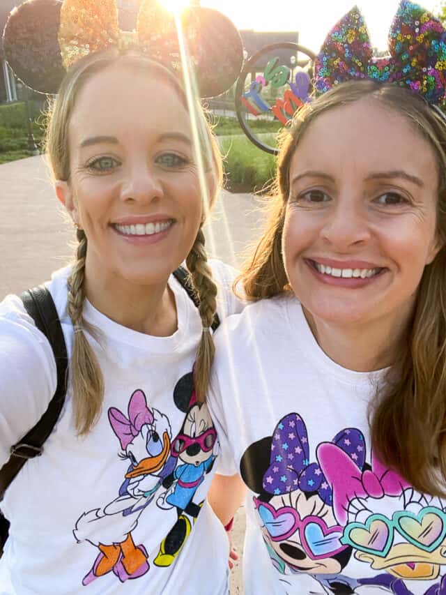 two girls in minnie and daisy shirts with mickey ears