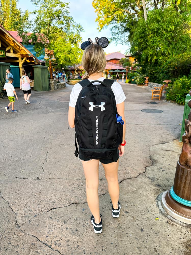 woman with disney backpack