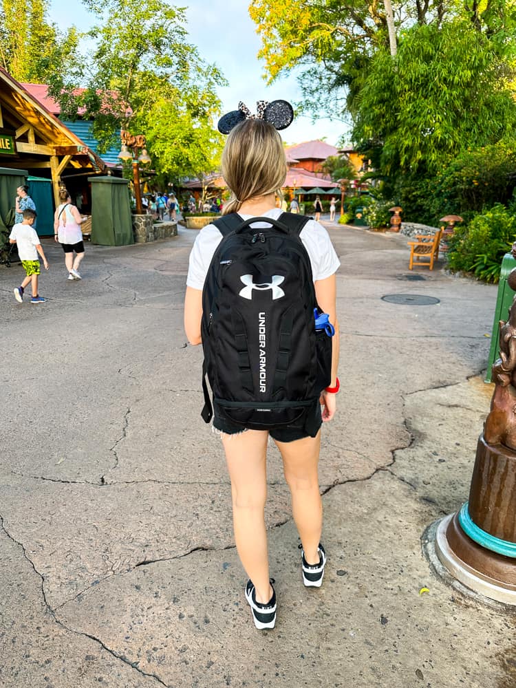 woman wearing backpack at Disney World 