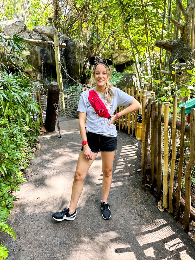 woman wearing backpack at disney world