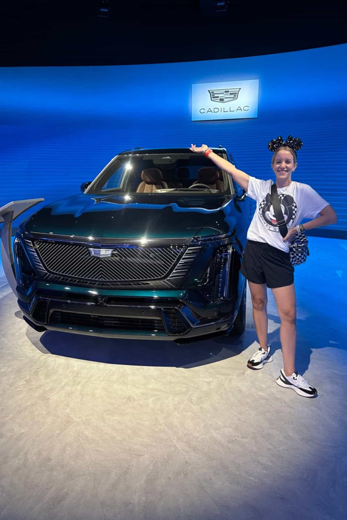 Woman with car at test track