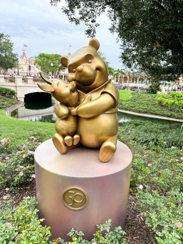 pooh and piglet gold statue
