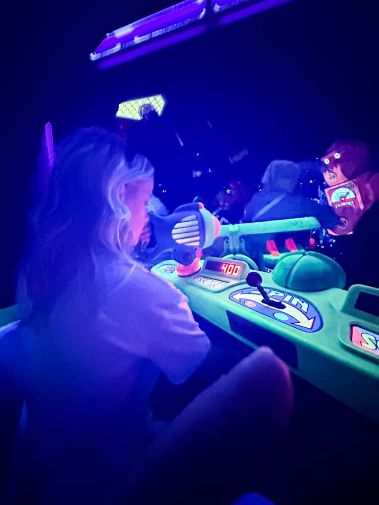 shoot the lazer at Buzz Lightyear's Space Ranger Spin