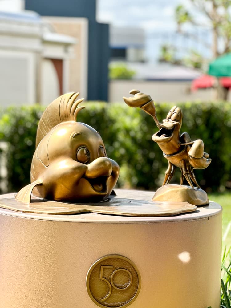 Sebastian and Flounder gold statue