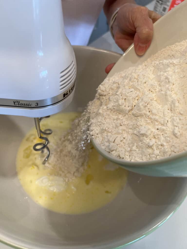 combining flour for beignets