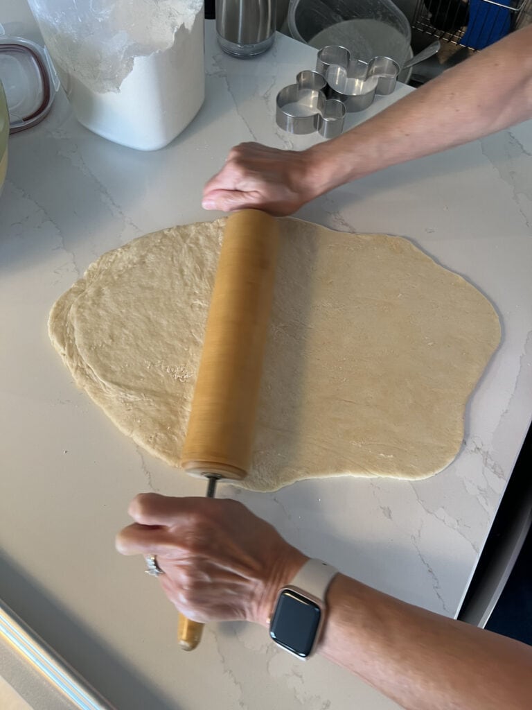 rolling out beignet dough