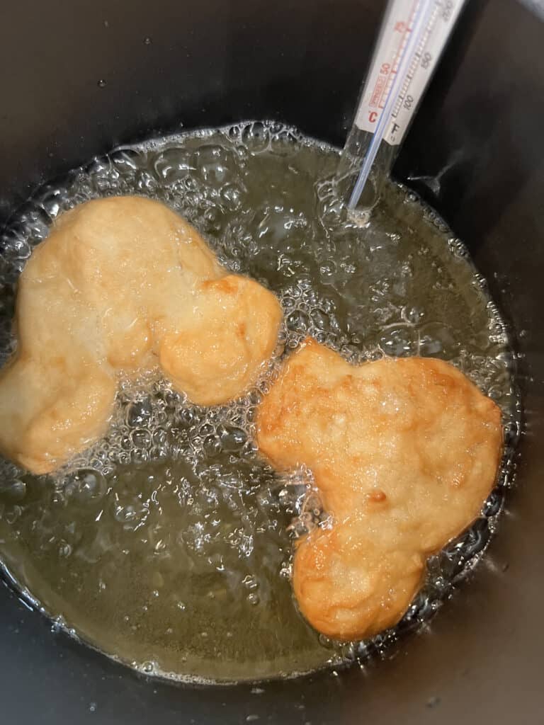 frying Mickey Mouse beignets