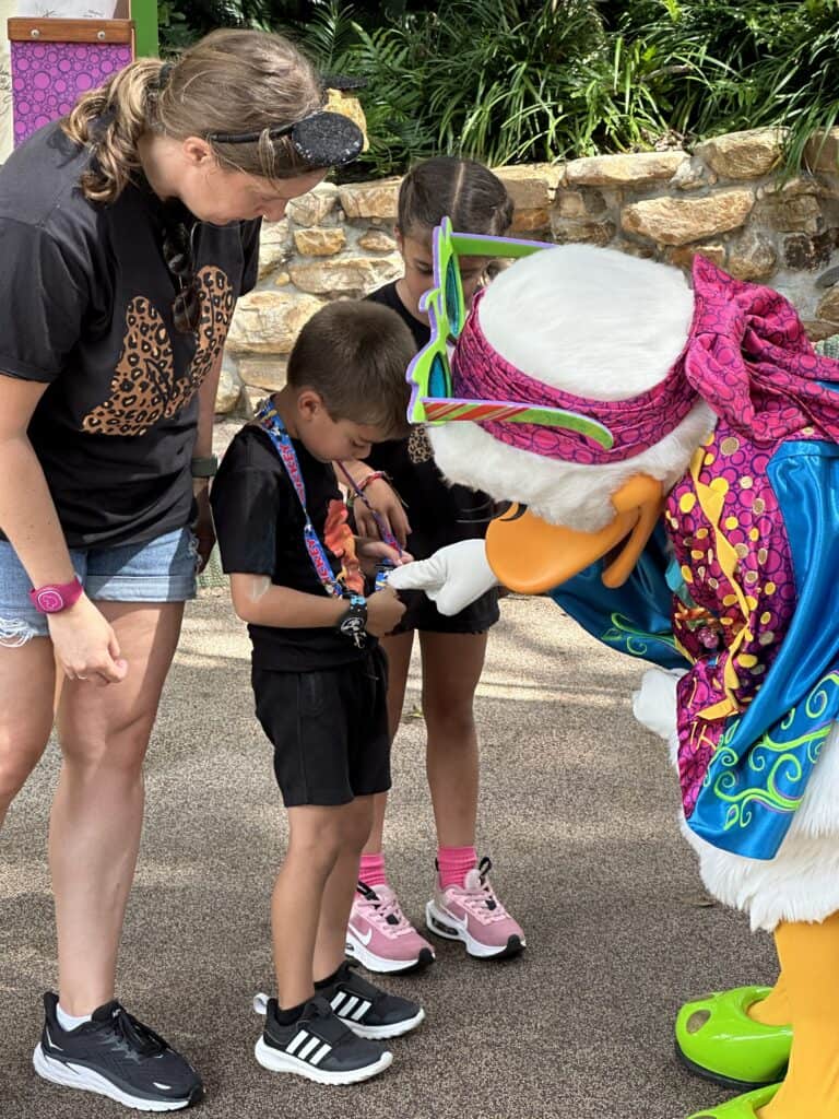 Daisy Duck interacting with kids