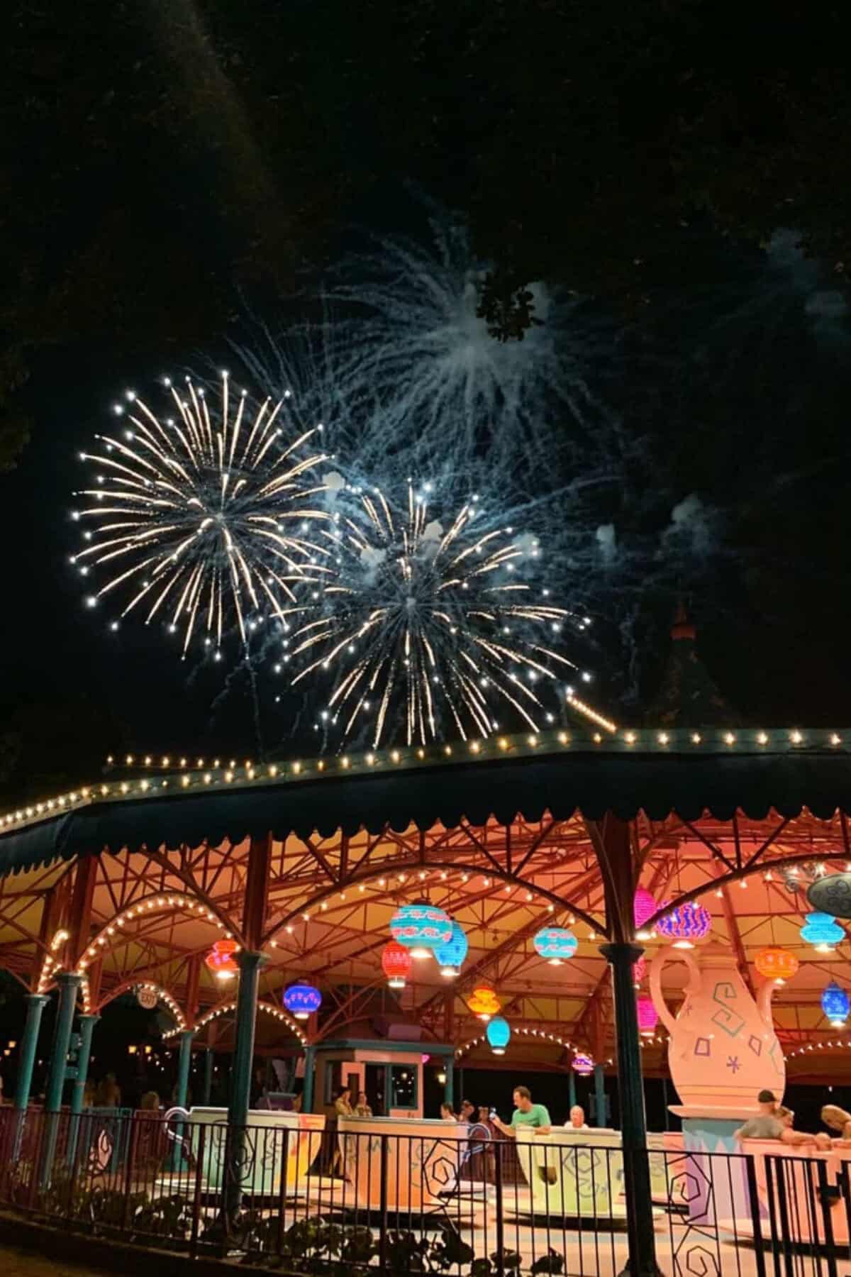 Fireworks by teacups in magic kingdom